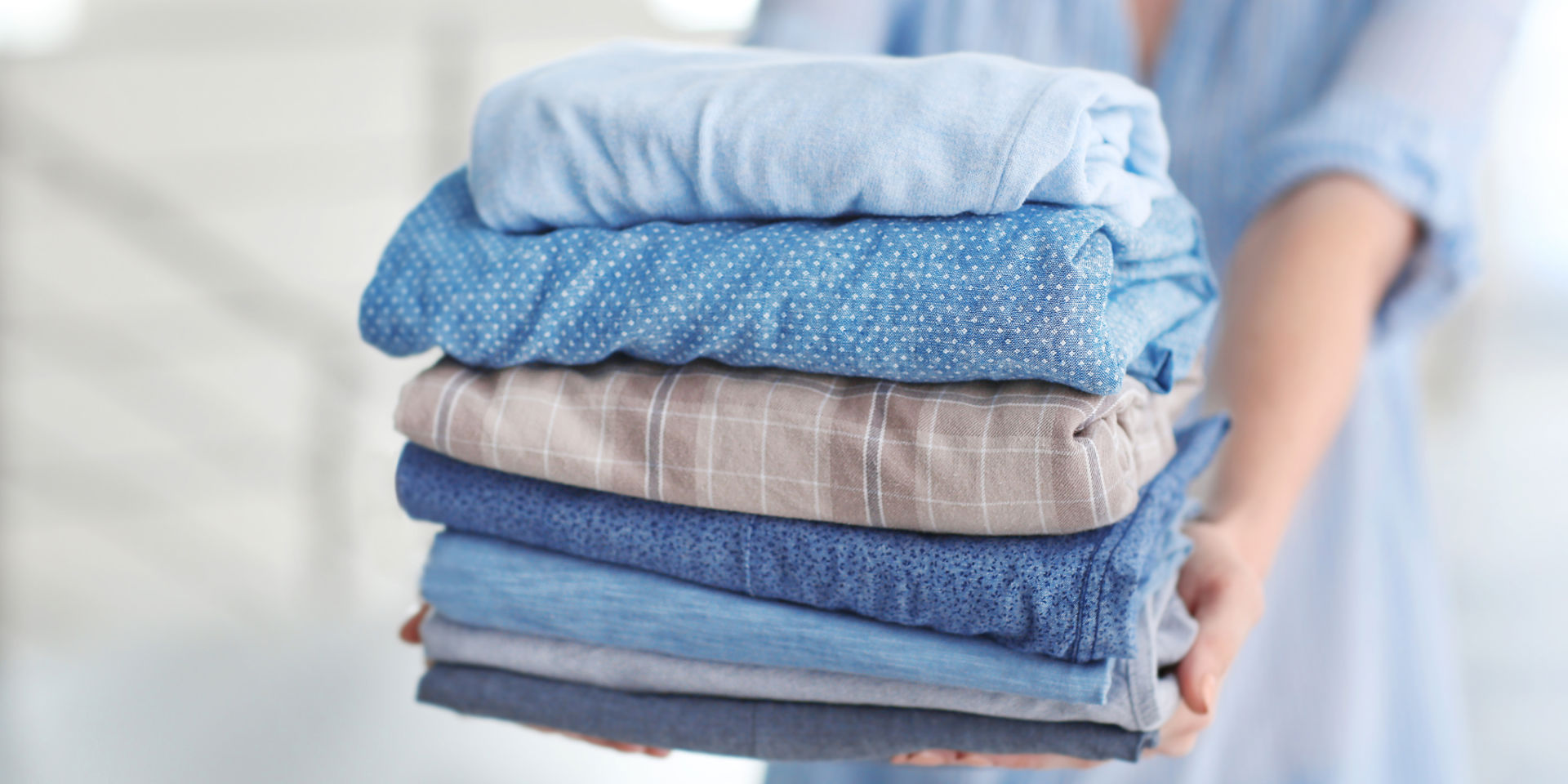Washed And Folded Clothes In Blue Tones